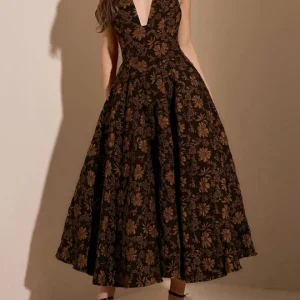 a women wearing printed a line dress